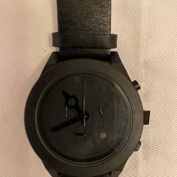 Aark Collective black leather watch.